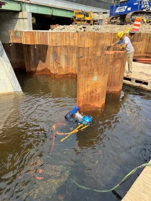 diver-and-construction-team-bridge-rebuild
