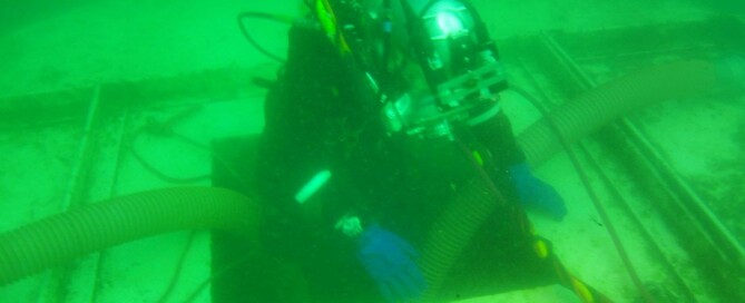 diver entering underwater tunnel